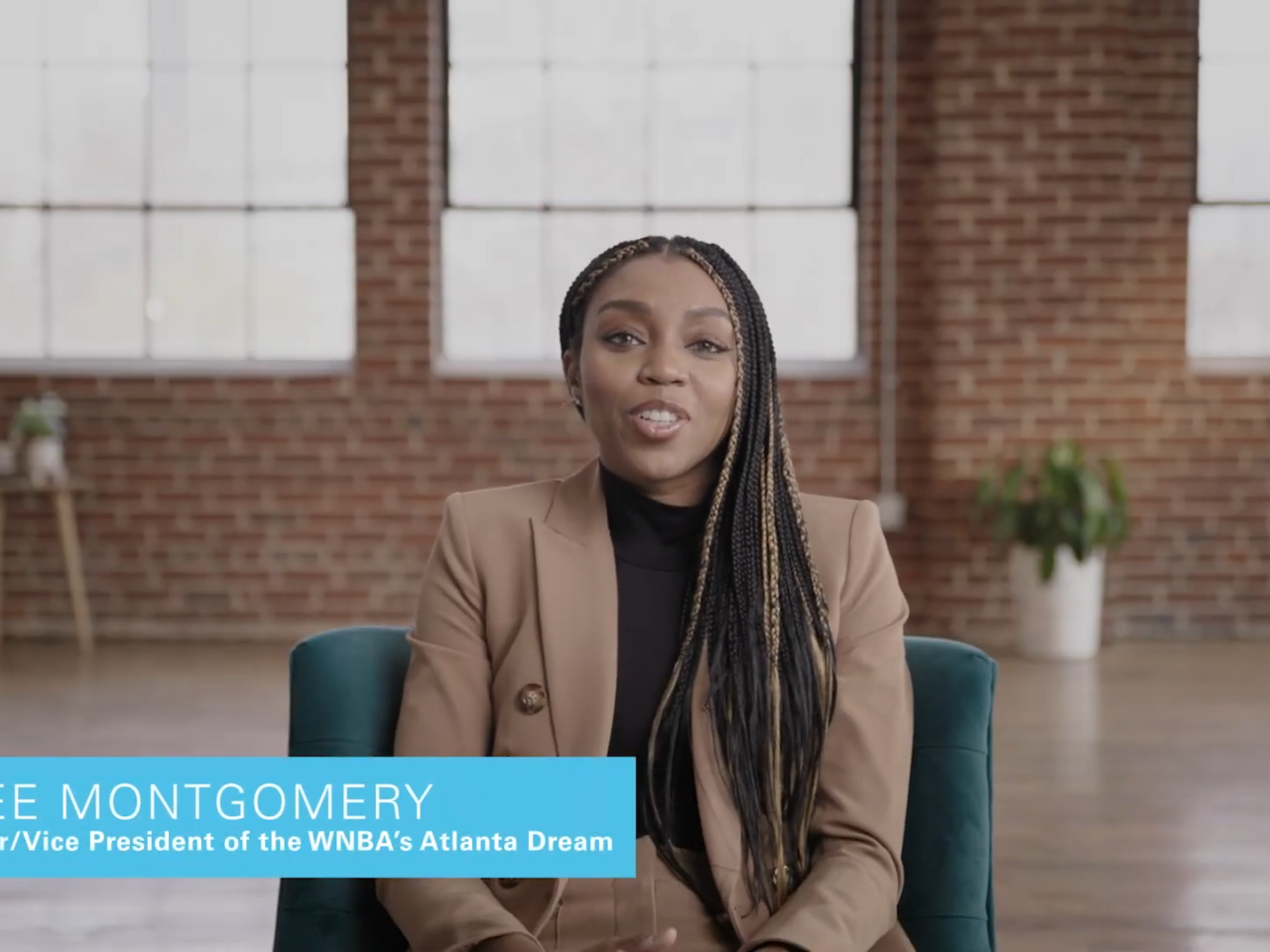 Renee Montgomery sitting on a chair talking to the camera