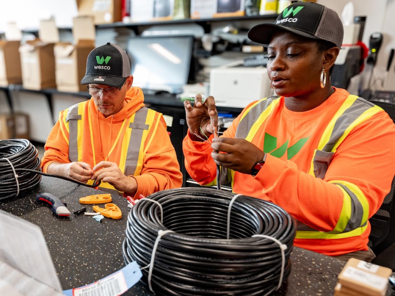 Wesco employees shown working on a production line.