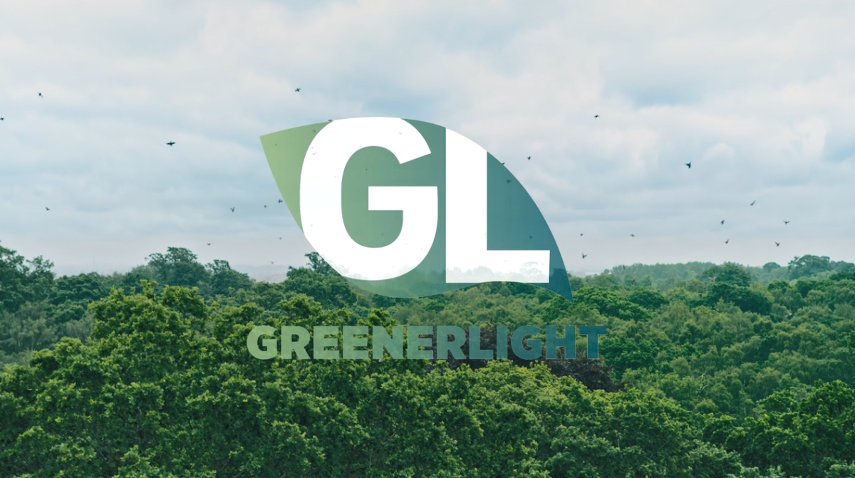 GreenerLight logo over a lush green canopy.