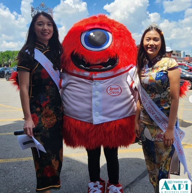 Albertsons Companies' Jewel-Osco Mascot posing with two people in traditional AAPI attire