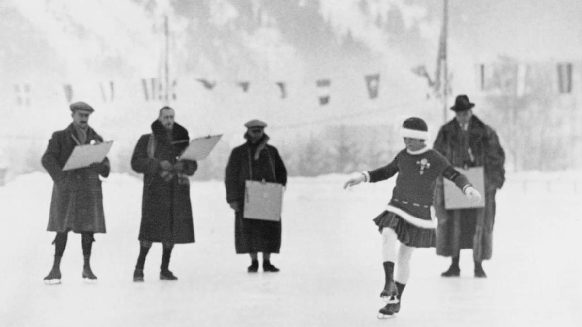 Black and white photo of a person ice skating