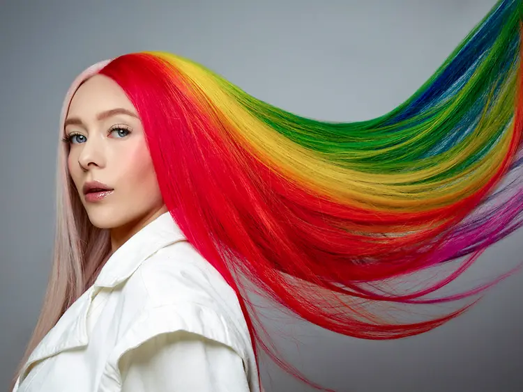 A person with long rainbow hair