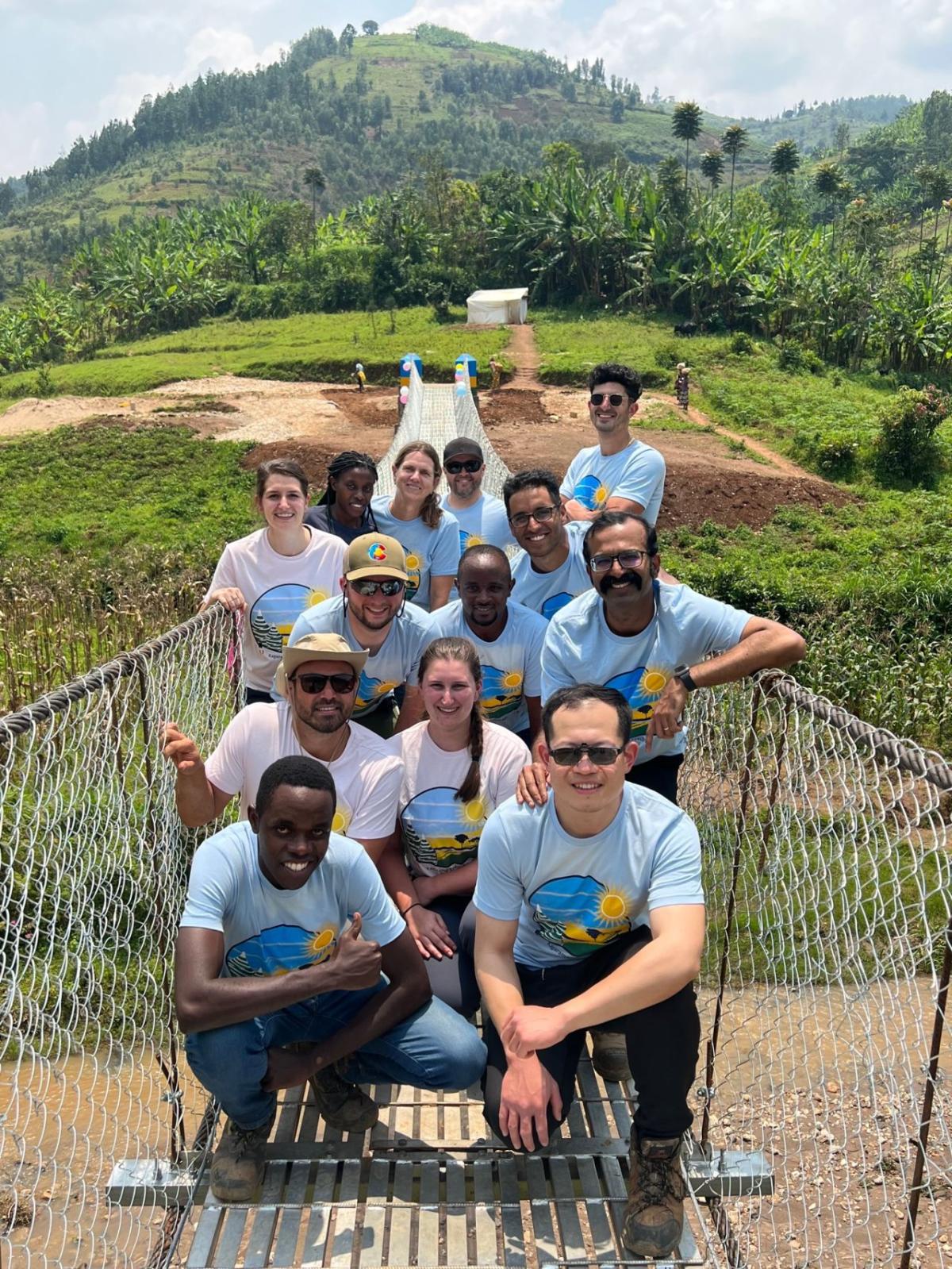 Bridges to Prosperity 2022 Team posing on Kagarama Suspended Bridge in Rwanda