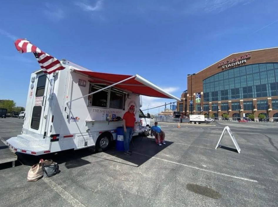 Two people outside a FedEx canteen truck