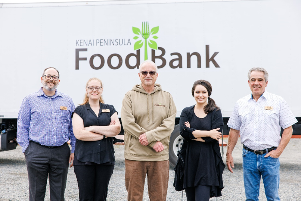 People standing in front of Kenai Peninsula Food Bank truck