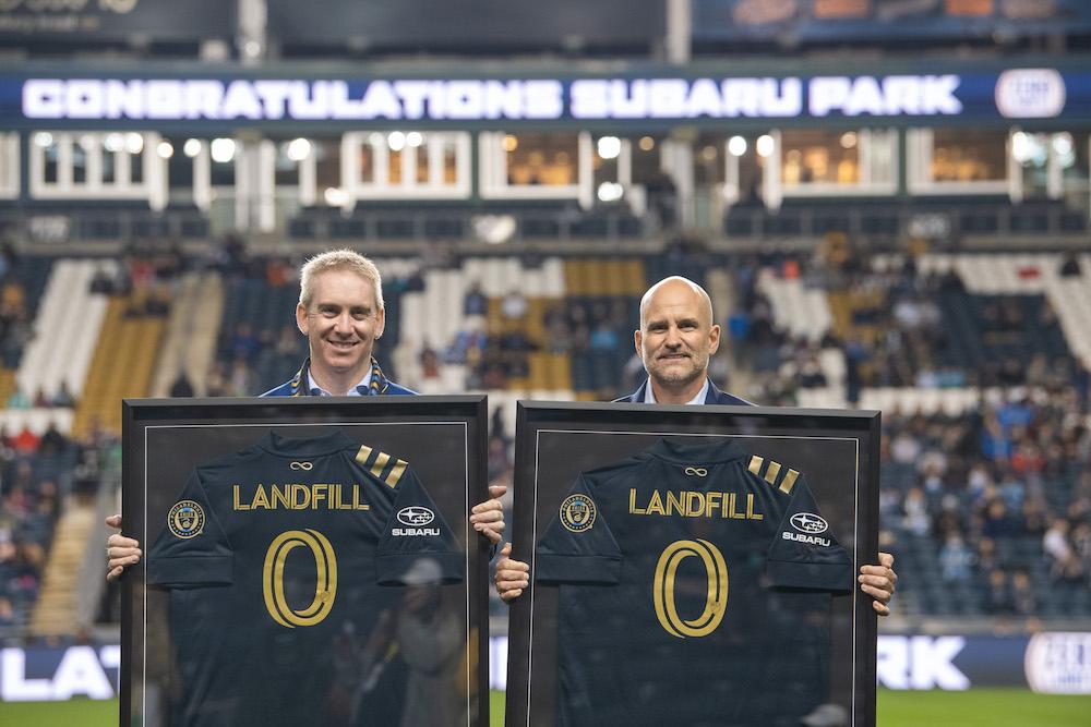 Alan Bethke, Subaru of America Inc.’s Senior Vice President - Marketing, and Tim McDermott Philadelphia Union’s President, celebrate Subaru Park becoming the first soccer stadium in Major League Soccer to achieve zero landfill status on October 23, 2021.  