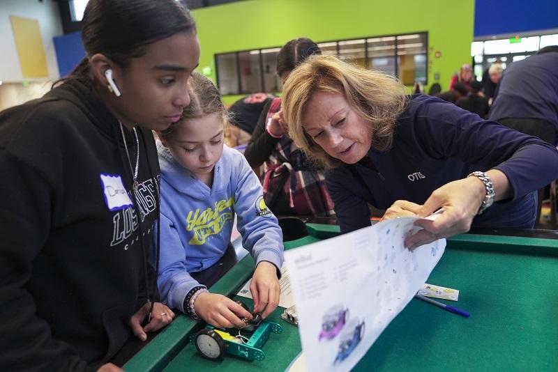 Otis volunteer working with Boys and Girls club members