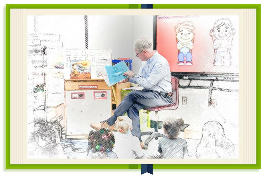 Bill Bateman reading to a classroom of children