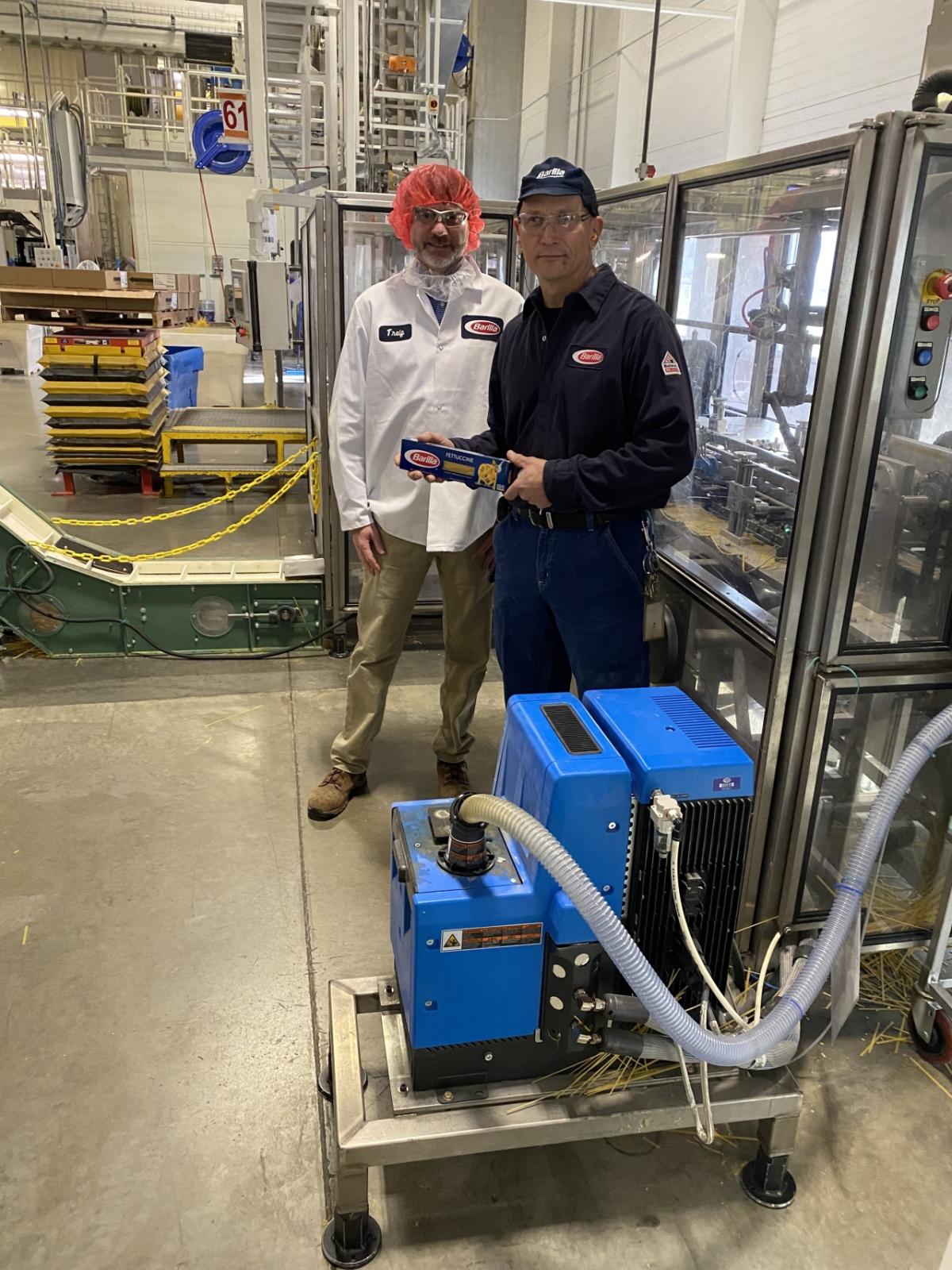 National Grid Energy Efficiency Specialist Jay Snyder and Barilla Plant Manager Bill Boula with new melt unit