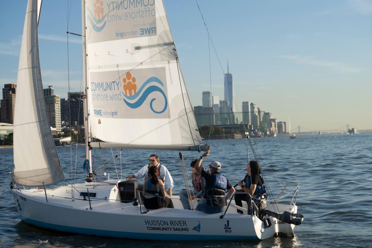 Sailboat with a Community Offshore Wind sign