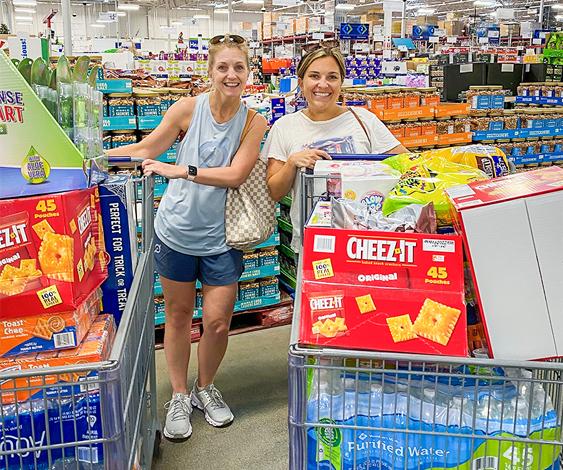 women with shopping carts