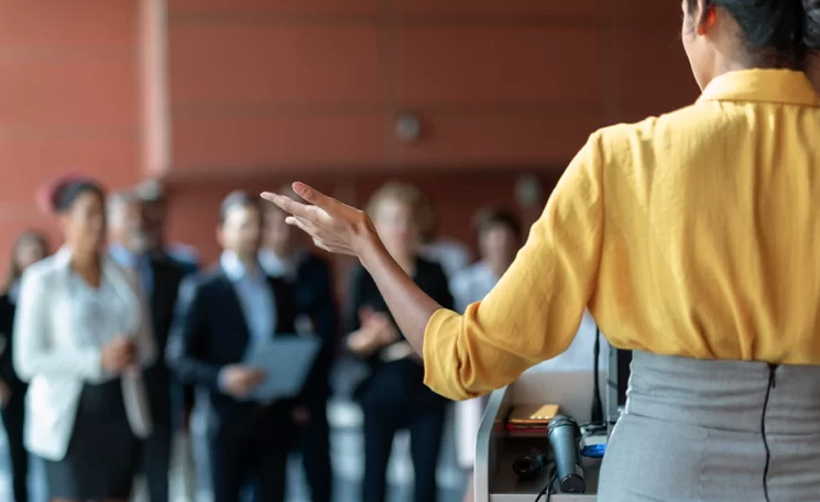 person speaking to an audience 