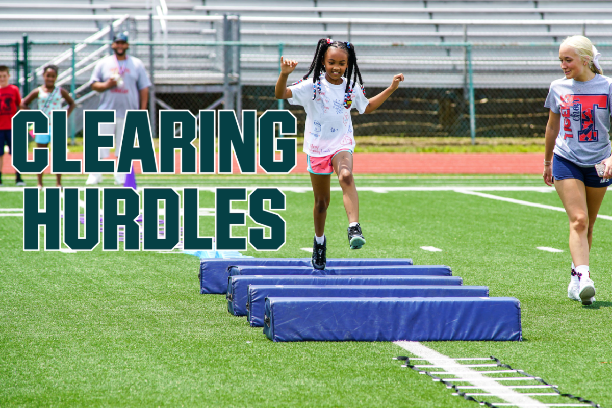 kid jumping hurdles