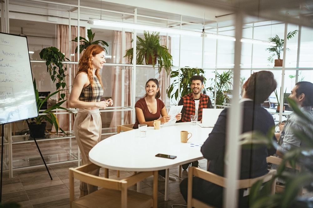 group of 4 sitting listening to a speaker