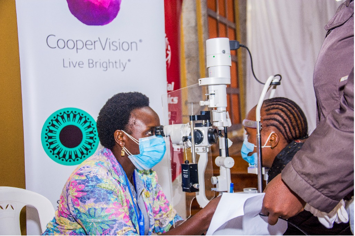 Woman performing eye exam