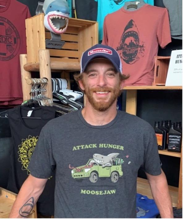 Mike Ash wearing Attack Hunger Moosejaw t-shirt.