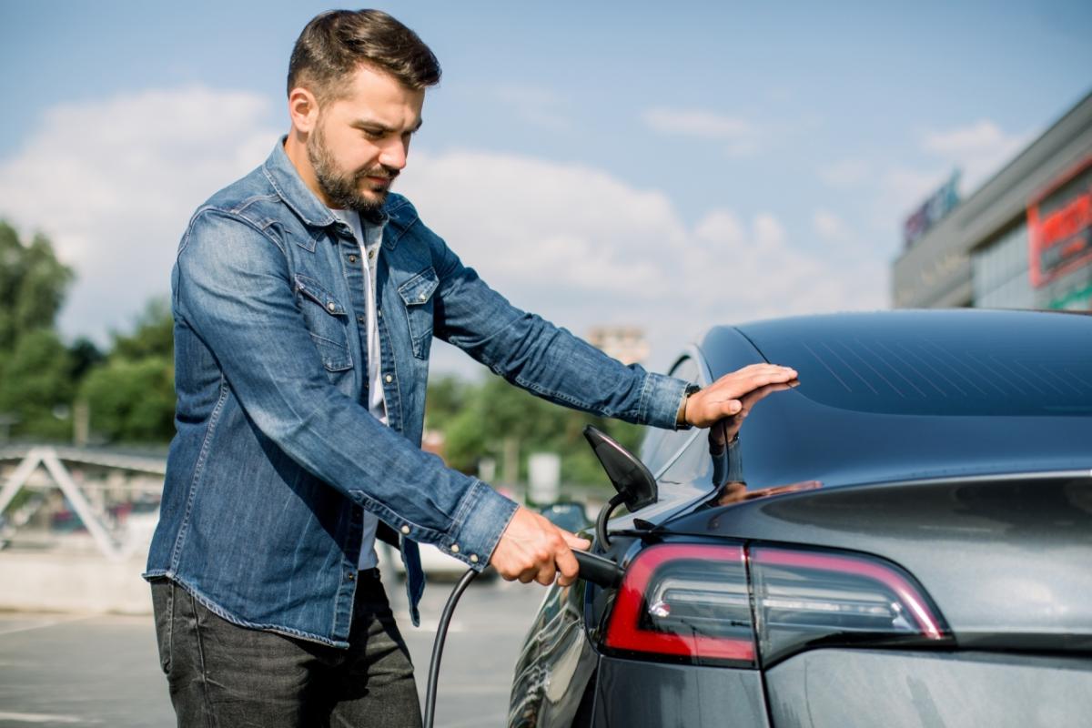 person charging their EV 