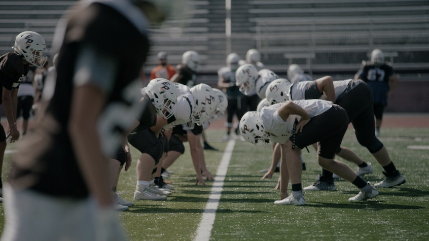 East Palestine High School football players practicing for game day.