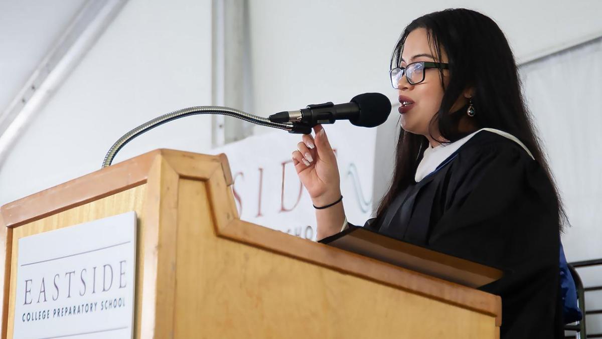 Student at Eastside College Preparatory School stood talking into a microphone