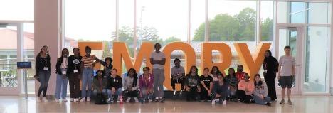 Group together in front of EMORY letters in window