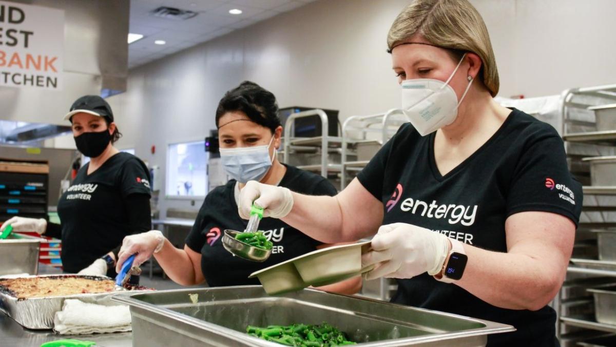 Entergy volunteers serving meals