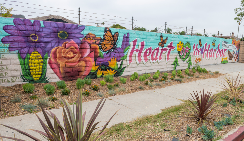 mural on a wall "Heart Harbor" with flowers, produce