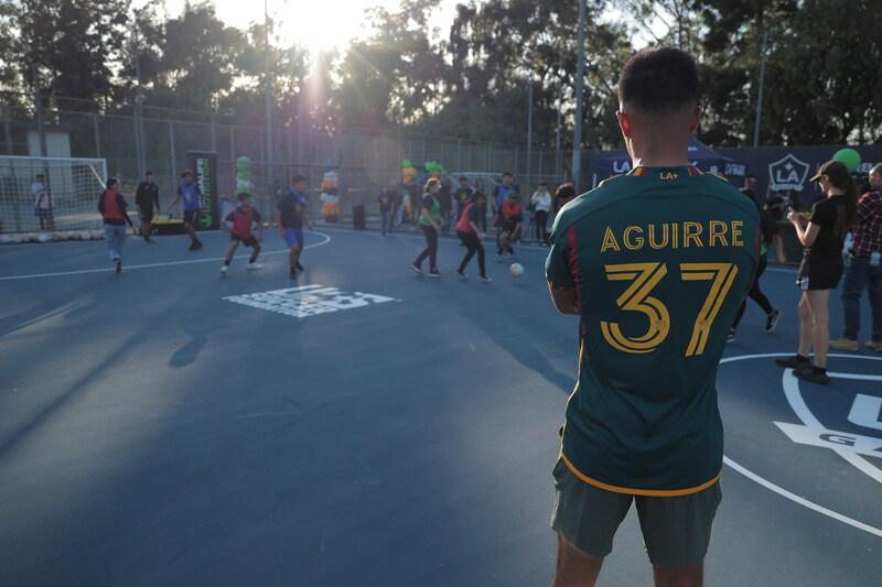 Aguirre watching kids play soccer at new pitch