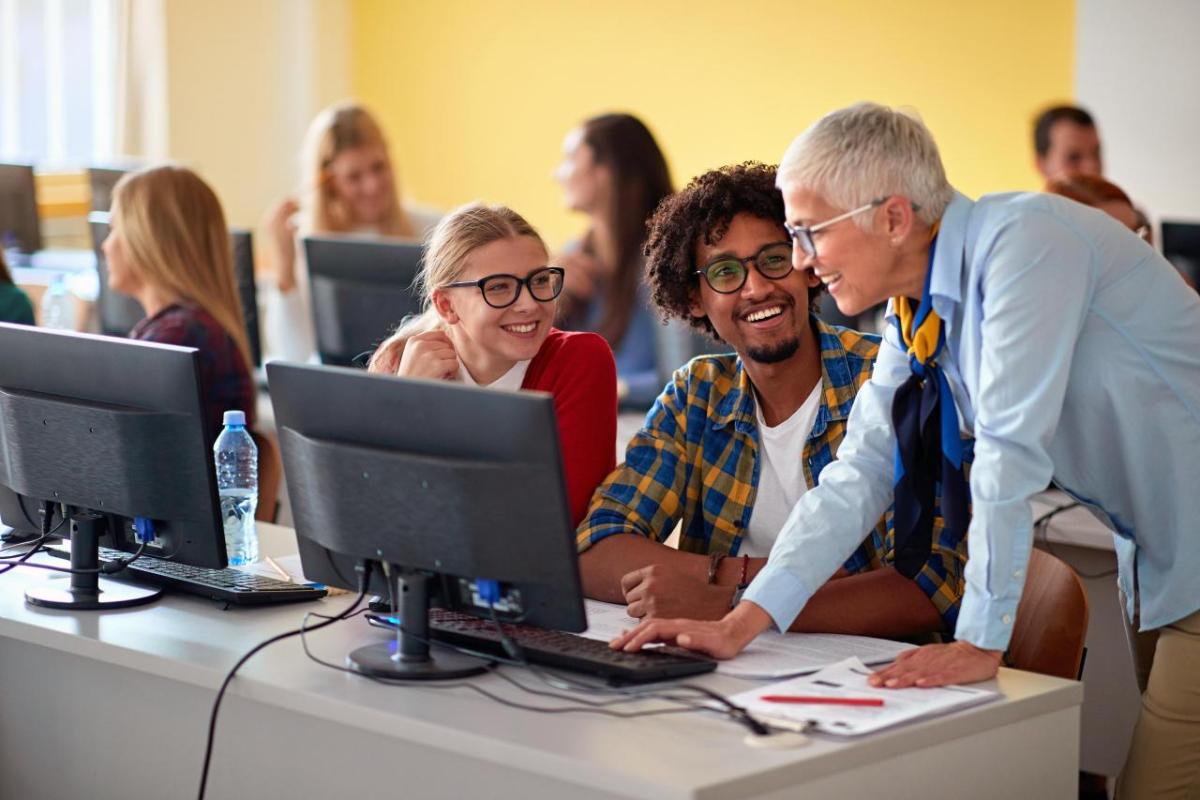 People gathered around a computer