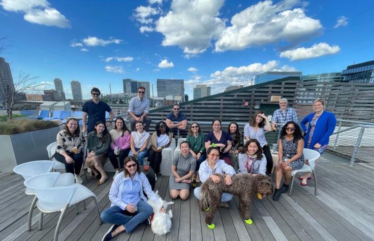 Embark Marketing Team seated outside their headquarters.