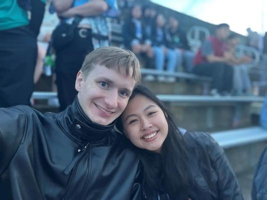 Kim shown with her boyfriend at a sporting event.