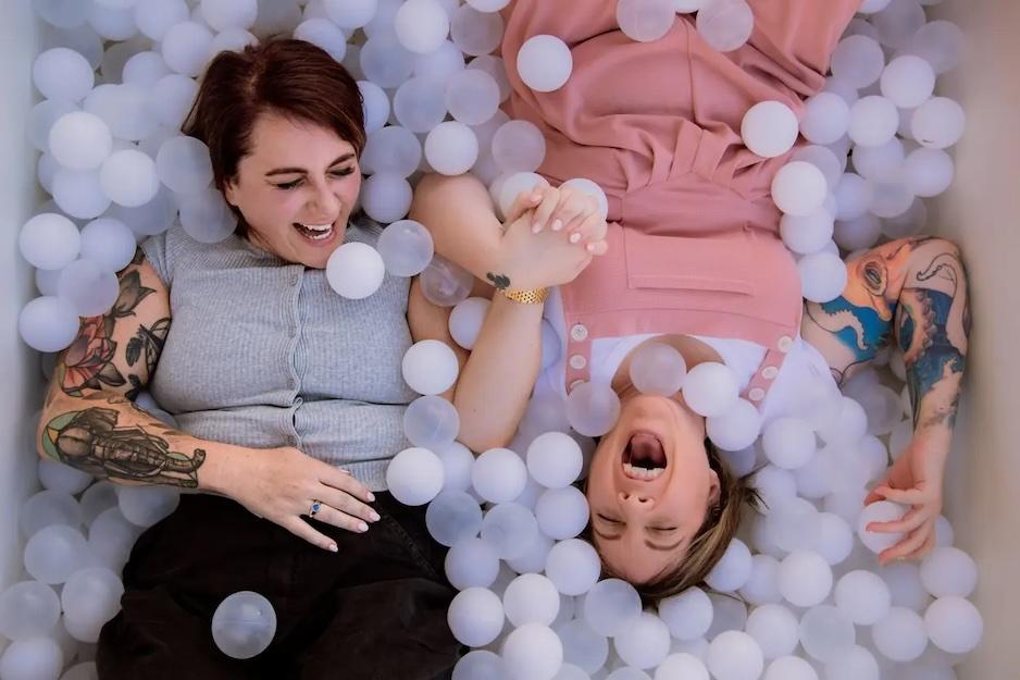 Lanie and Renee shown in a box of bubbles.