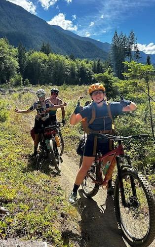 Lindsey Henry cycling on a trail. 