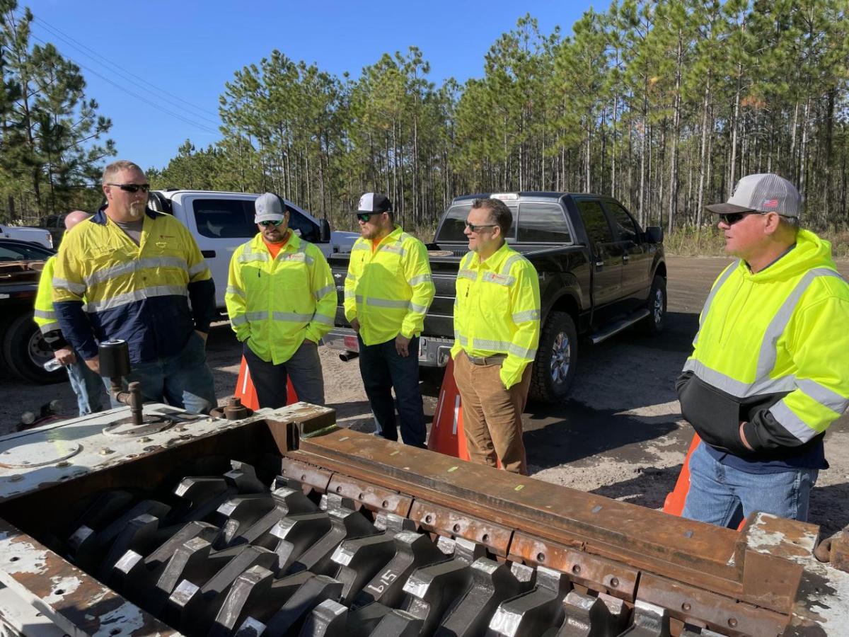 Crew standing outside Mission Mine