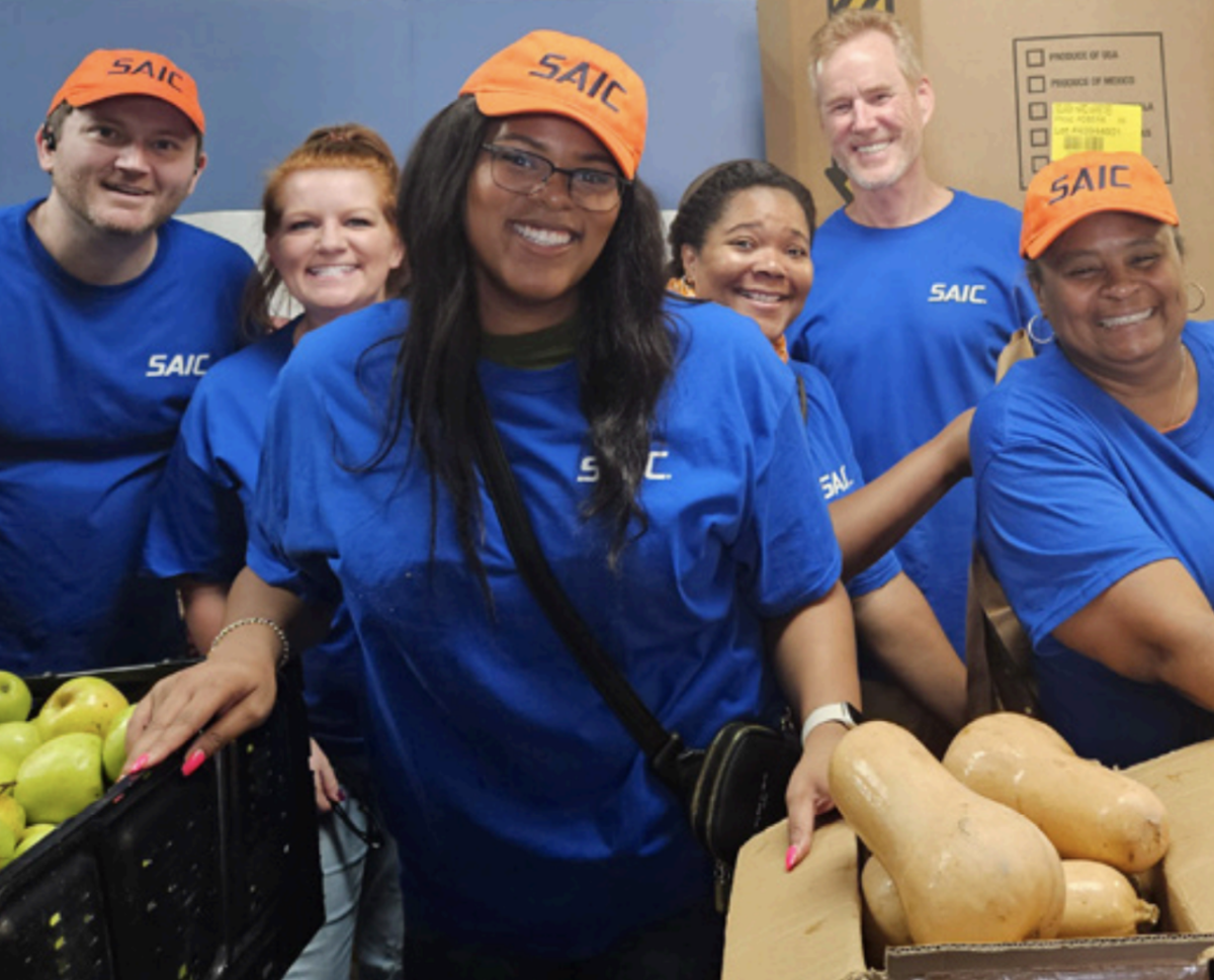 A group of volunteers wearing blue t-shirts 