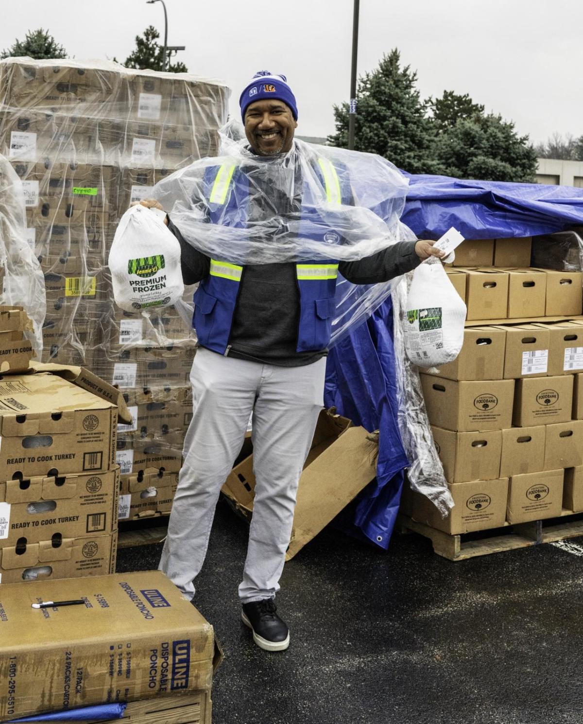 Volunteer holding turkeys