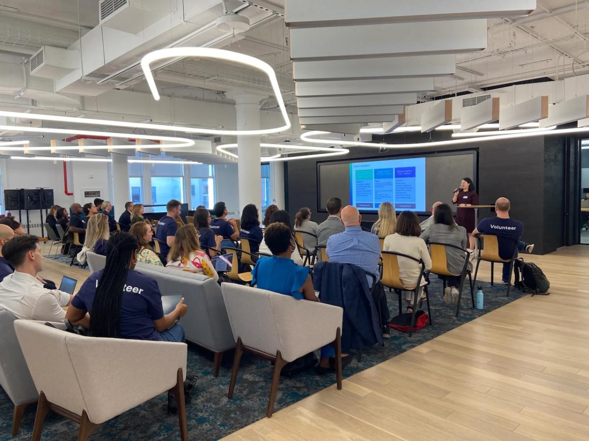 Nielsen and Common Impact team members shown in a meeting room in NYC.