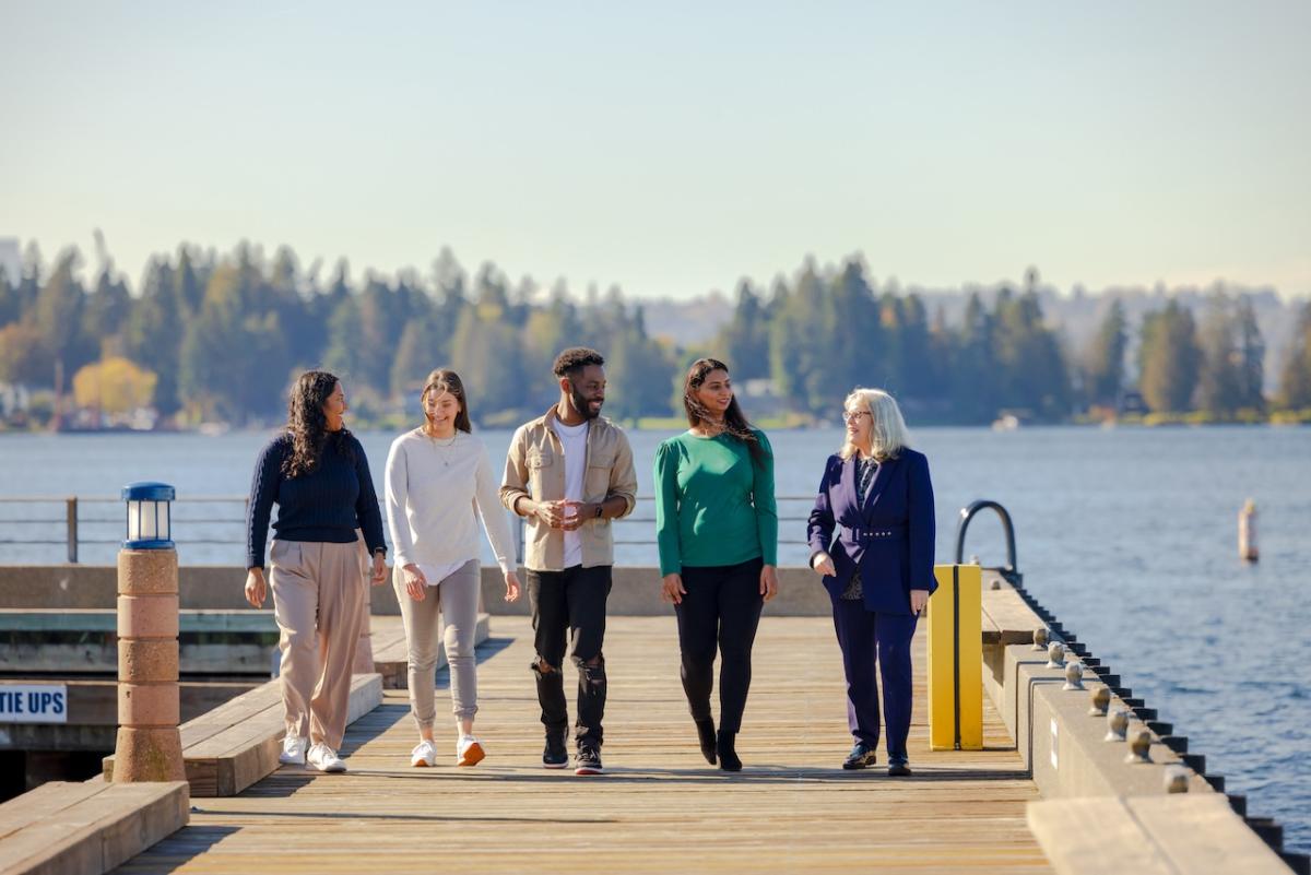 Group of GoDaddy employees walking along a pier.