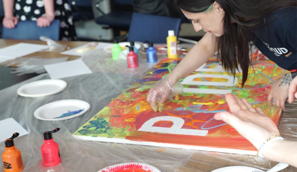 People make pride banner