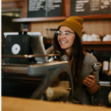 Young female behind a counter.