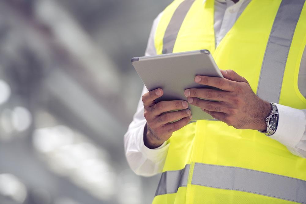 person wearing a yellow safety vest