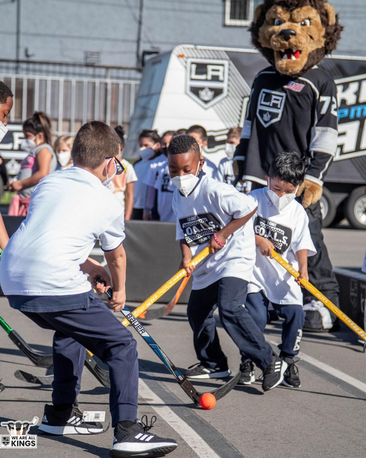 Students play Ball Hockey on the the playground of Longfellow Elementary in Compton, Calif. 