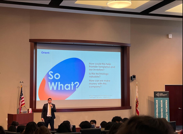 Person presenting to an auditorium