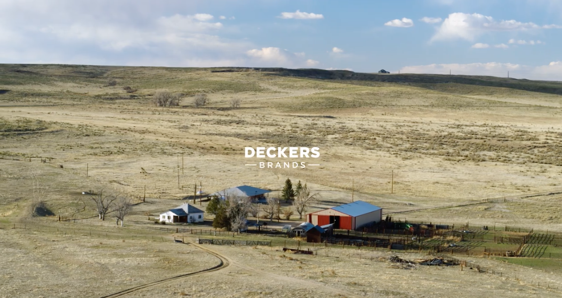 farm house in field with Deckers logo