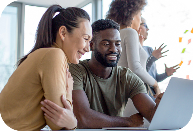 two people looking at laptop screen