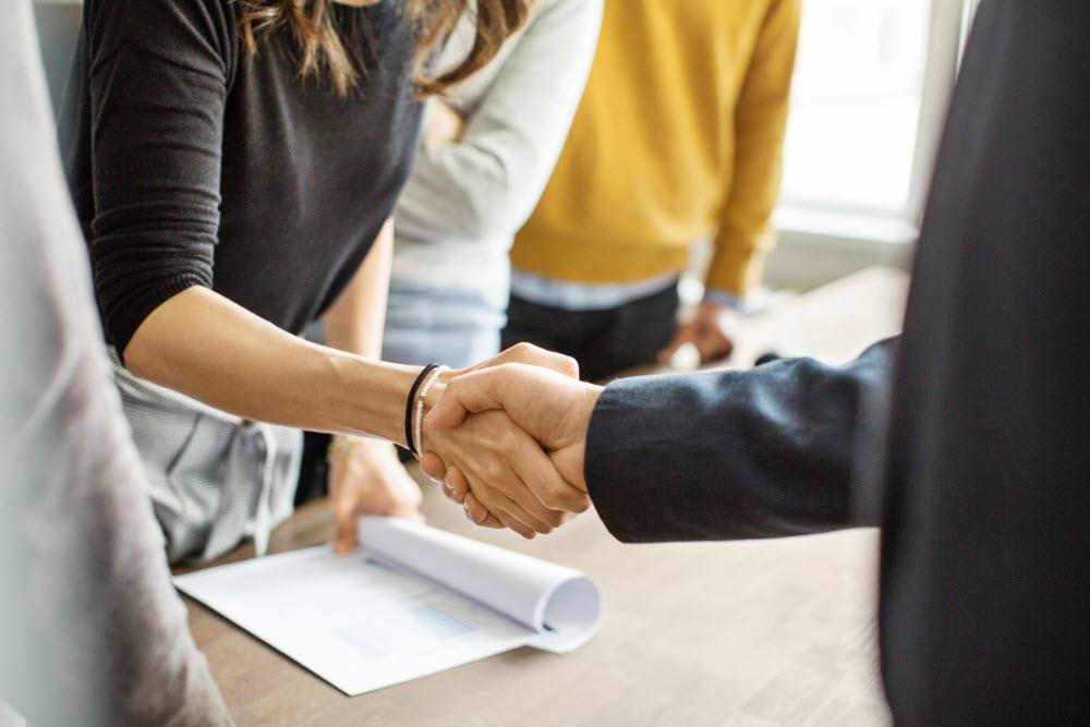 Two people shaking hands.