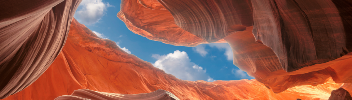 canyons, seen from below with blue sky overhead