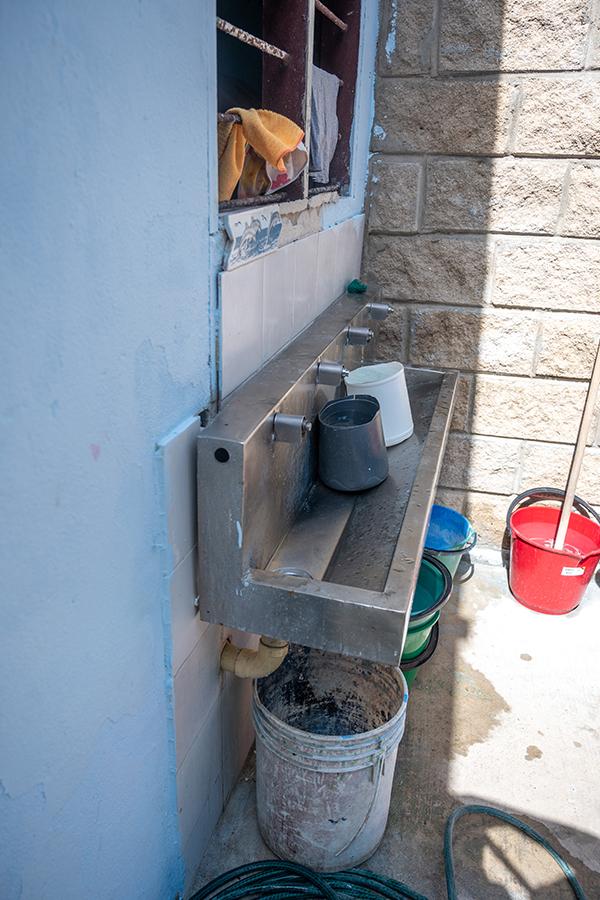 Sink with buckets lined up