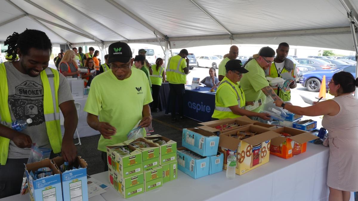 Alsip, IL team preparing food bags for local food pantry.