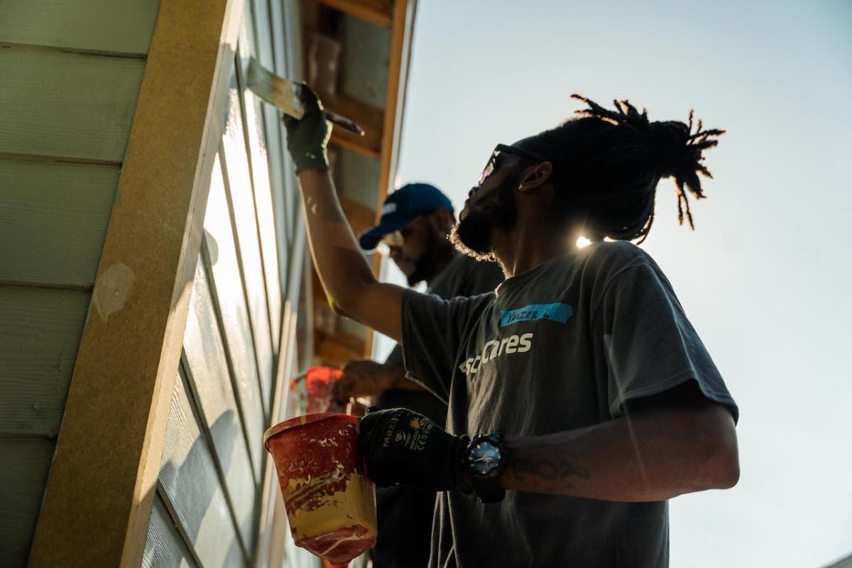 Wesco team members painting.