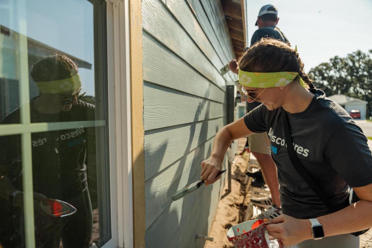 Wesco team member painting.